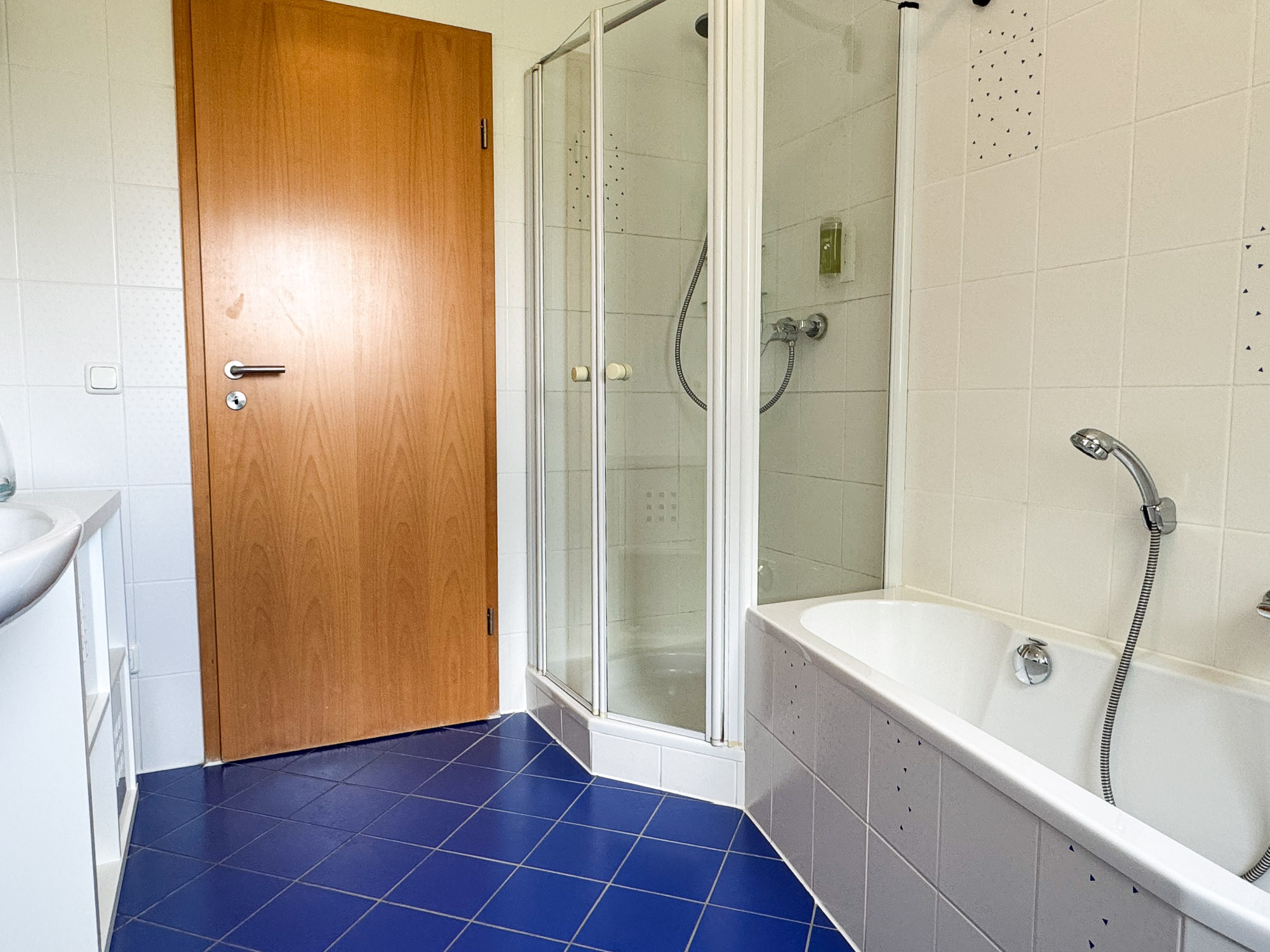 Bathroom with bathtub and shower