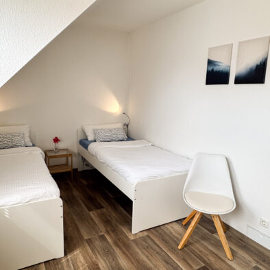 Zweites Schlafzimmer mit zwei Einzelbetten